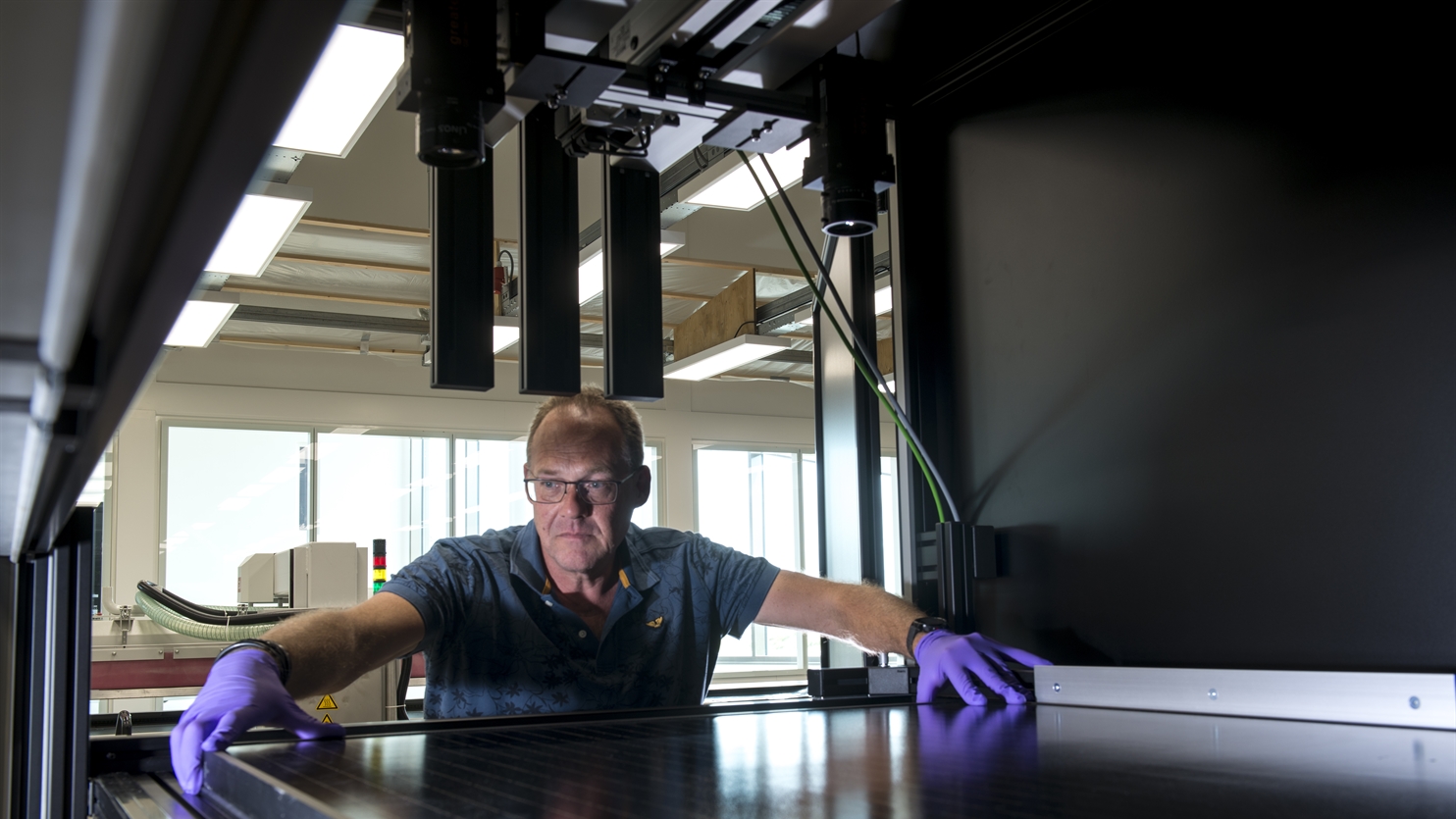 Man working with solar panel in lab